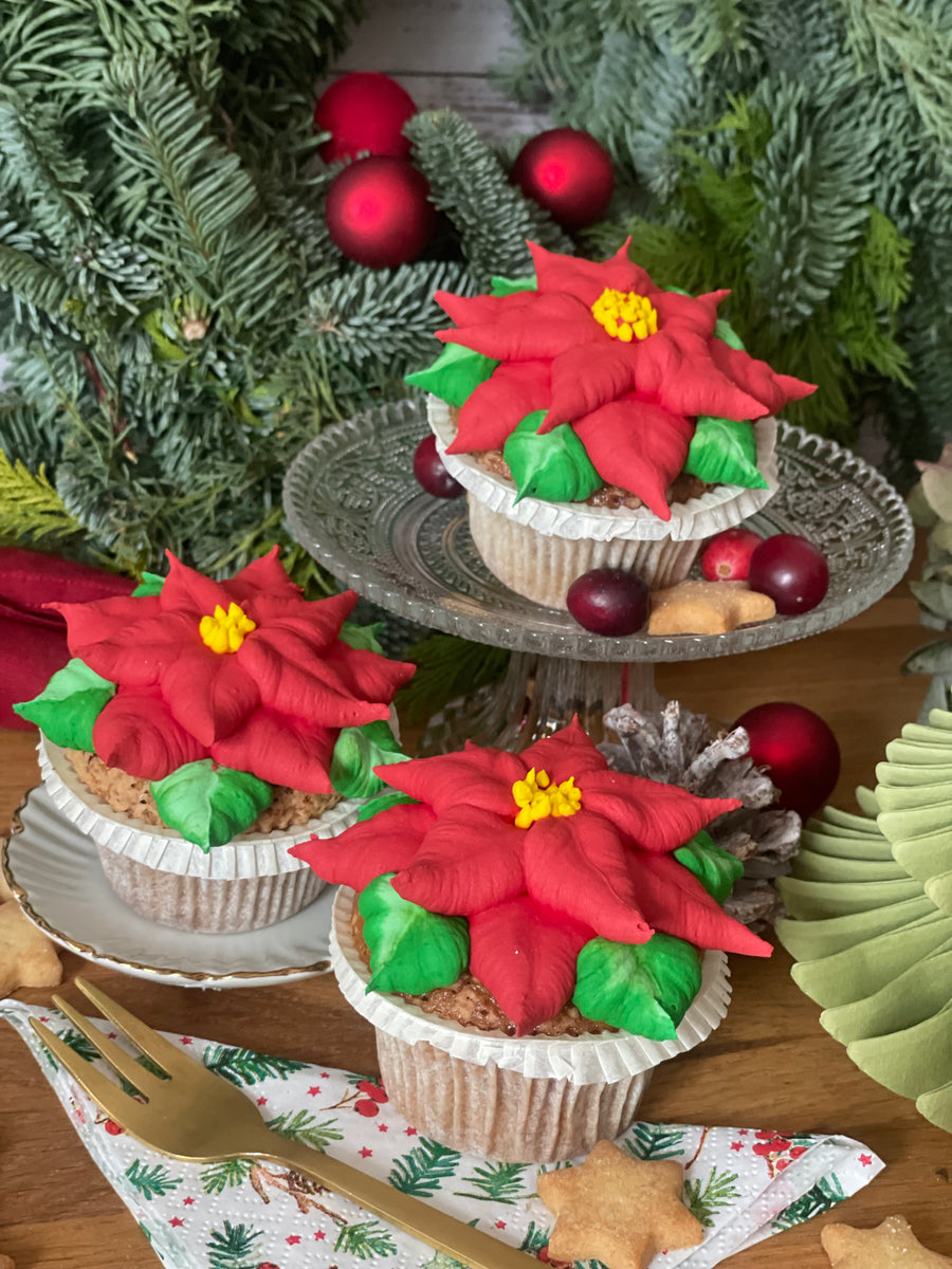 Roter Weihnachtsstern Cupcake