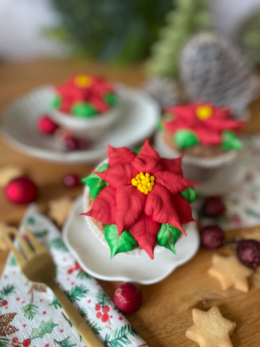 Roter Weihnachtsstern Cupcake